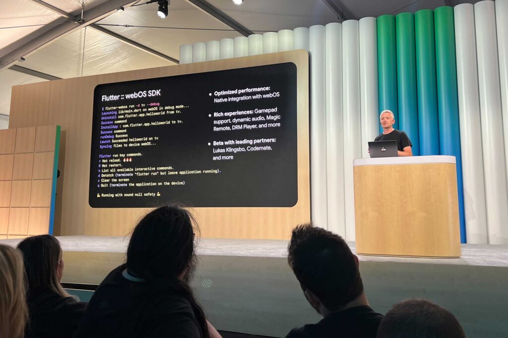 A speaker presents on stage at Google I/O in May, introducing the Flutter webOS SDK. The slide highlights features like native webOS integration, dynamic audio, and lists beta partners including Lukas Klingsbo, Codemate, and others.